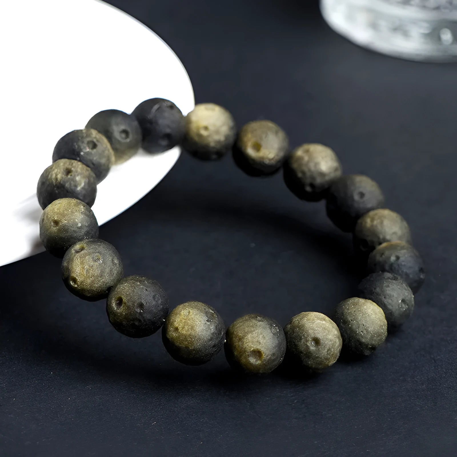 Obsidian crater ball bracelet with grinding texture in silver or golden meteorite colours