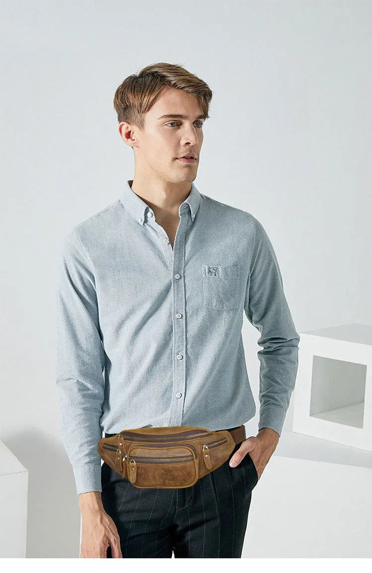 Brown leather retro messenger bag with a single shoulder strap shown open.