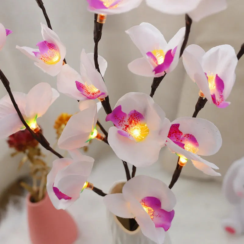65cm tall pink LED phalaenopsis branch decorative light with fabric and plastic shell on bedside table