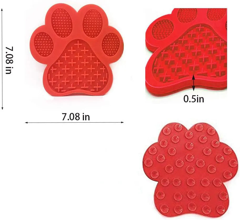 Blue bone-shaped silicone dog licking mat with suction cups on back, held against a tile wall.