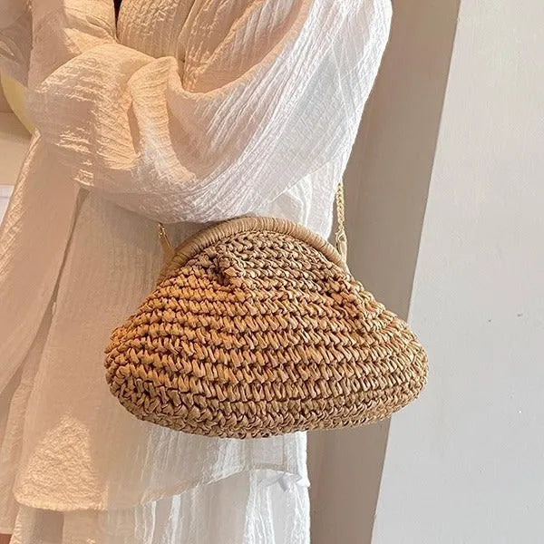 Women's shell-shaped straw shoulder bag with paper construction and zippered interior compartment