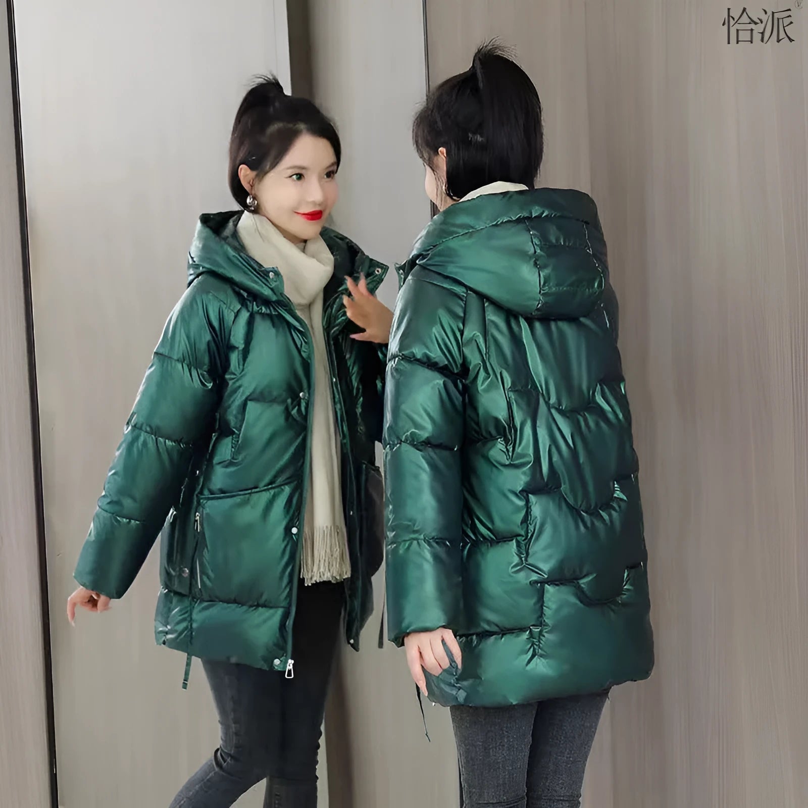 A loose-fitting, hooded winter jacket for women in a thick acrylic blend fabric, shown on a hanger.