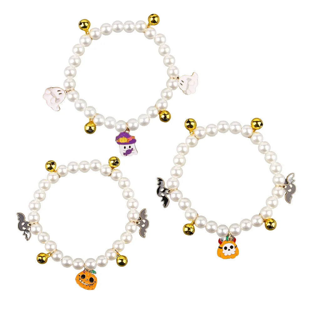 Halloween cat collar with simulated pearls and pumpkin designs including purple ghost, skull, and smiling pumpkin patterns