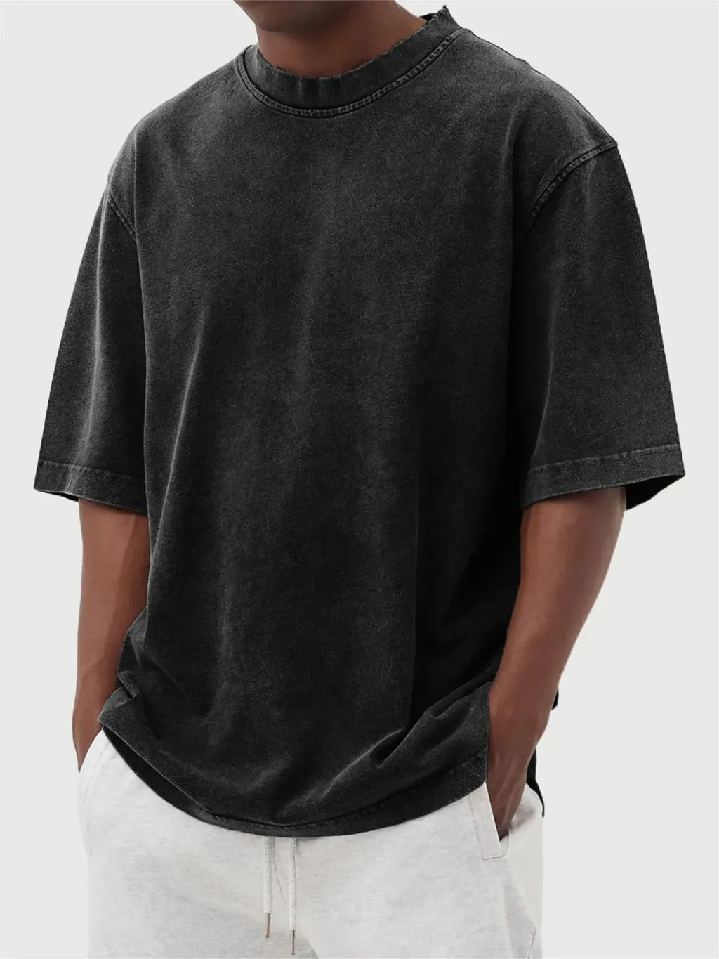Men's loose fit distressed pullover T-shirt in solid colour options including blue, black, and army green