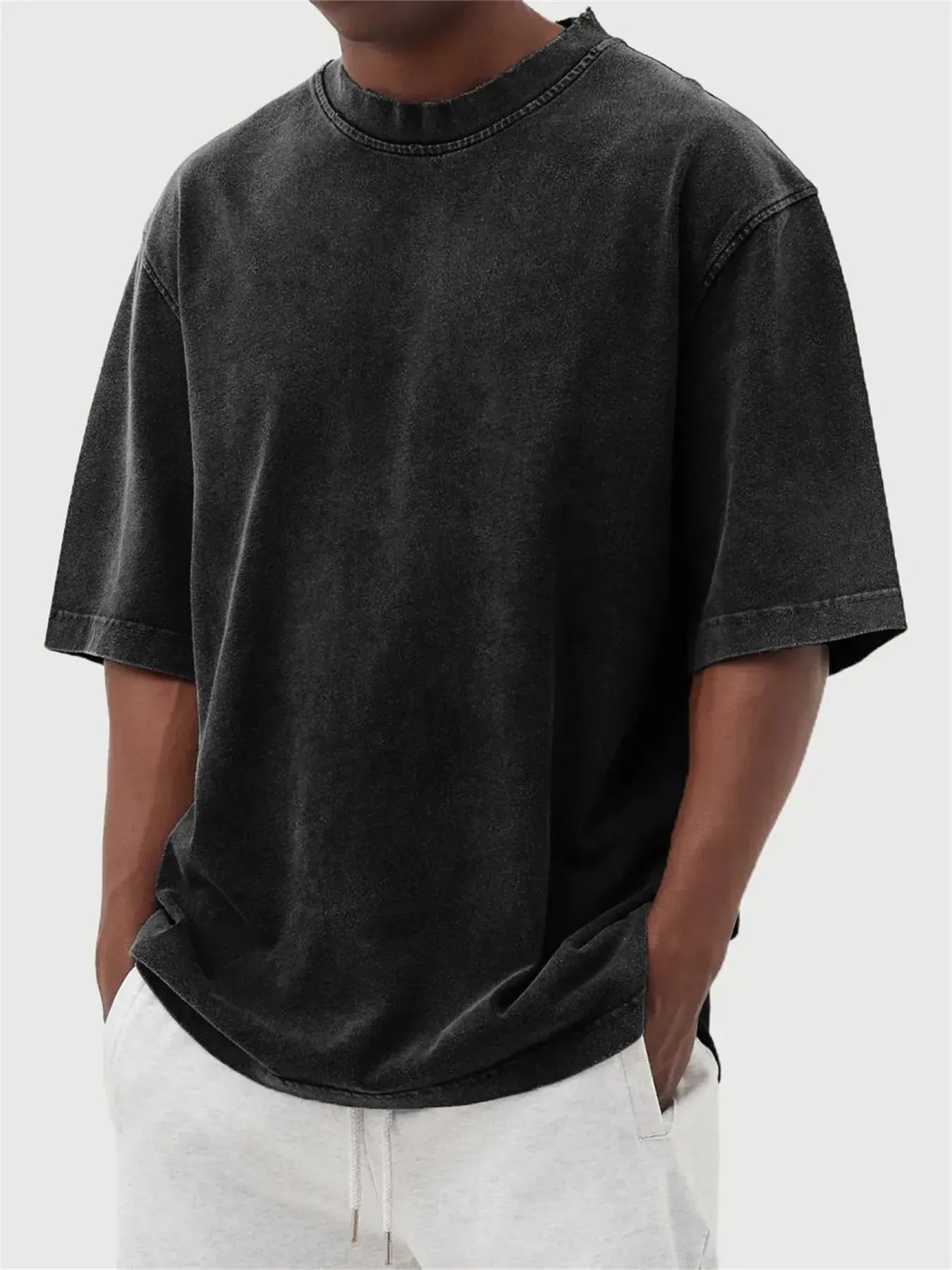 Men's loose fit distressed pullover T-shirt in solid colour options including blue, black, and army green