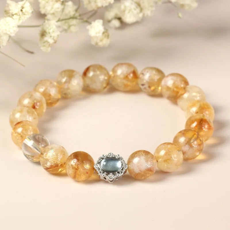 Geometric citrine crystal bracelet with 10mm stones on a wrist.