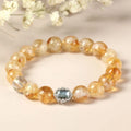 Geometric citrine crystal bracelet with 10mm stones on a wrist.