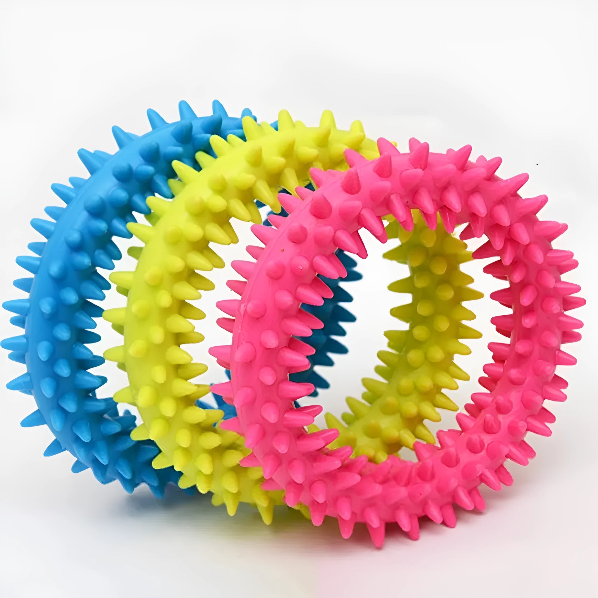 TPR spiky circle ring dog chew toy in various colours showing textured dental cleaning nubs