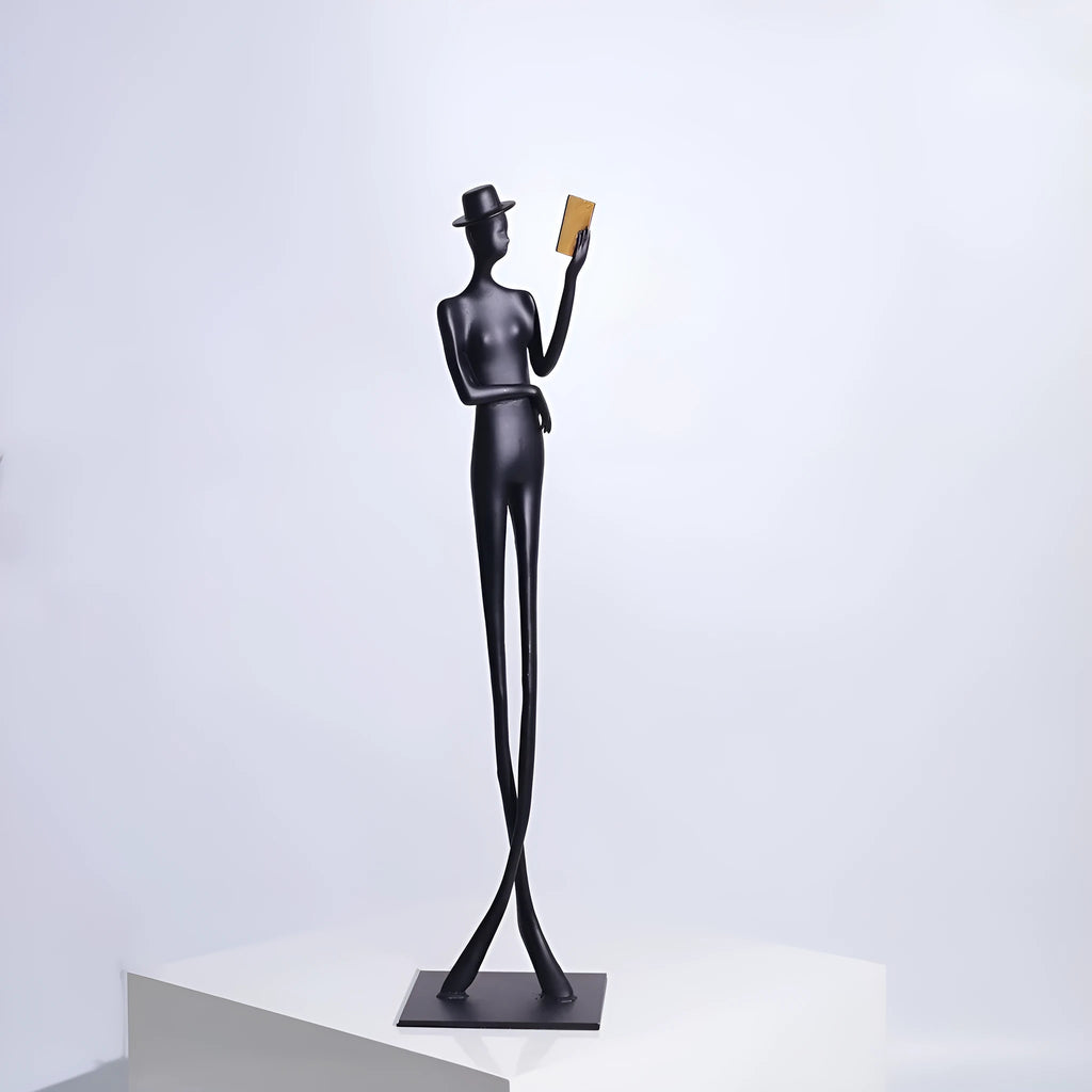 Black cast aluminium desktop sculpture of reading woman figure, modern design