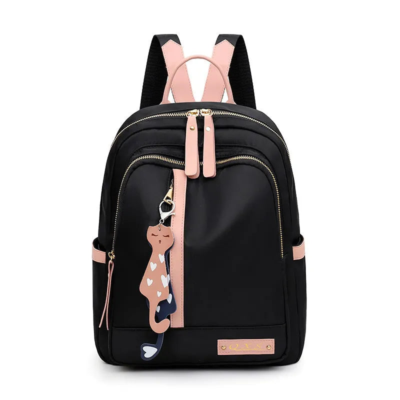 Black or pink women's casual nylon backpack with soft handle, showing internal zipper pockets and double shoulder straps.