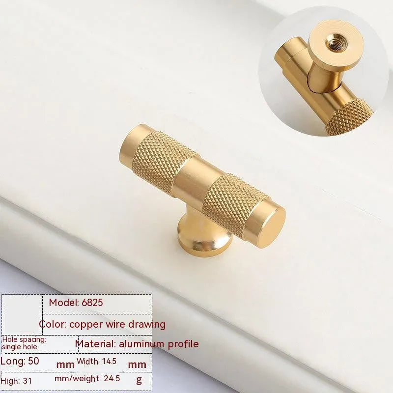 Aluminium furniture handle with brushed brass finish showing European style design