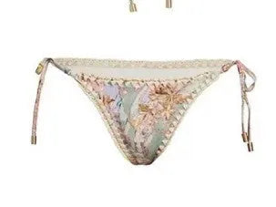 Women's creamy white floral bikini set with matching skirt for beach and swimming