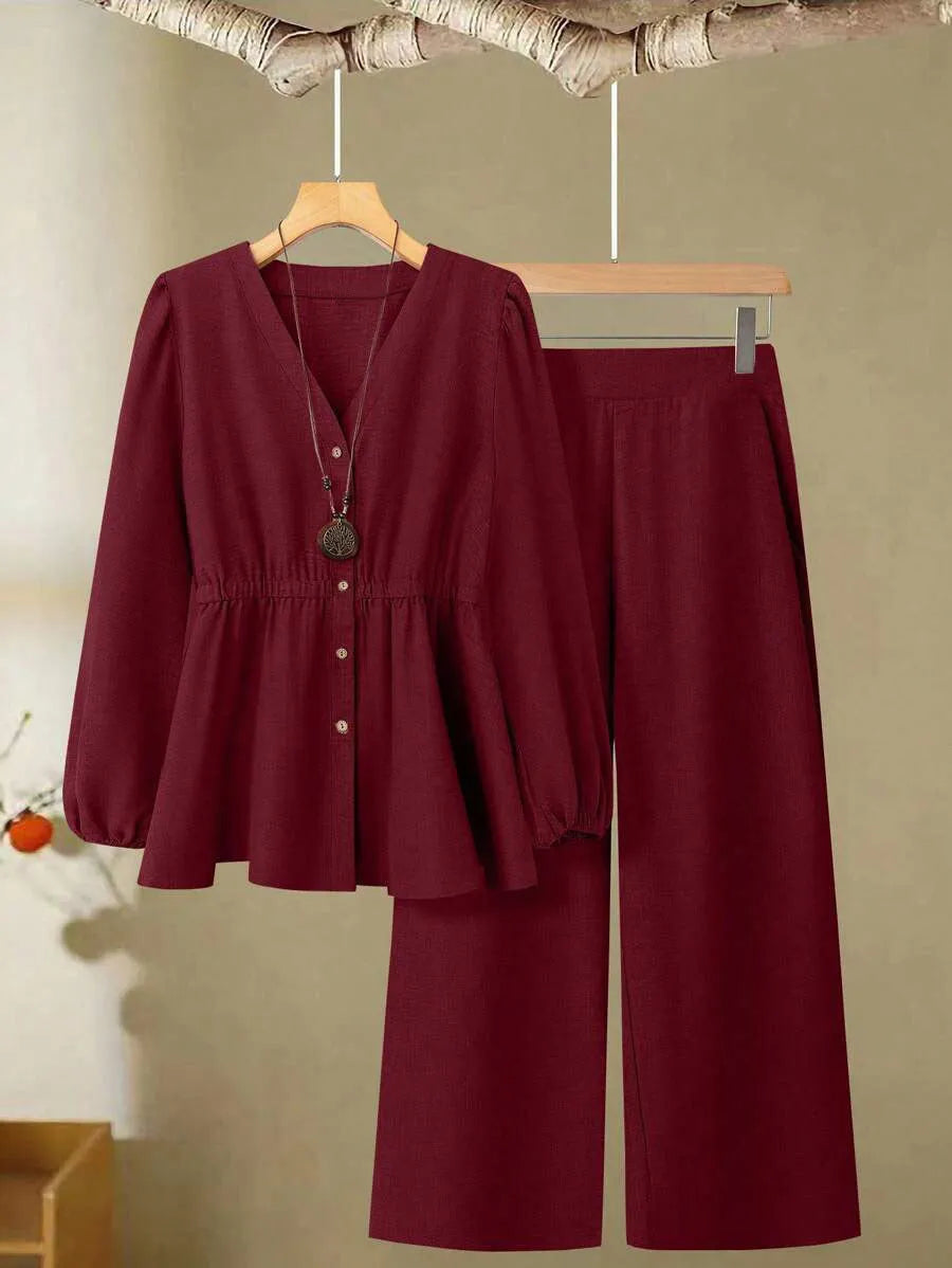 Women's long-sleeved two-piece polyester suit in khaki with button front top and matching trousers on model
