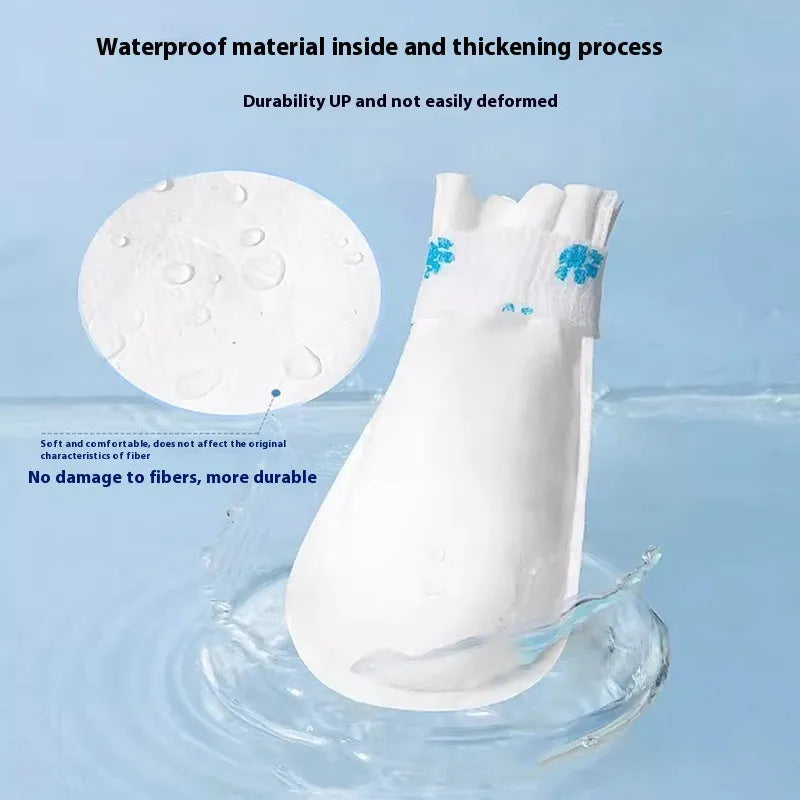 White disposable waterproof shoe covers for pets with slip-resistant soles in S and M sizes