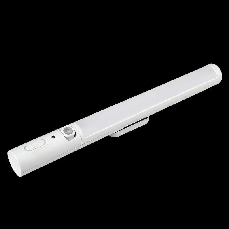 Slim white human body induction LED wall light with magnet back for under-cabinet or wardrobe installation.