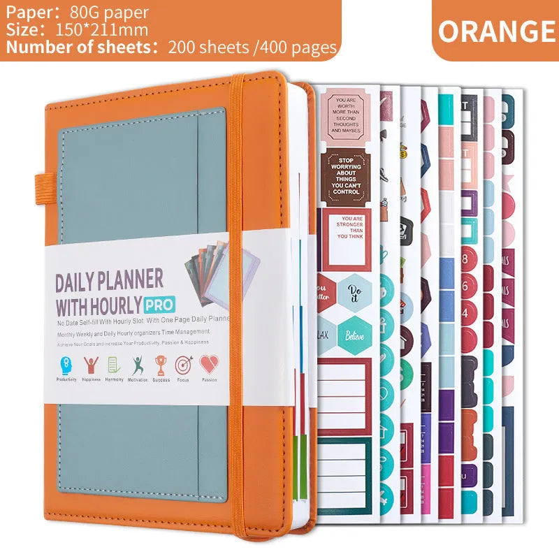 A6 self-filled notebook with PU cover in various colours, shown open on wooden table.