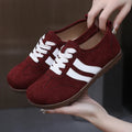 Women's canvas sneakers with round toe and flat rubber sole in dark red colour