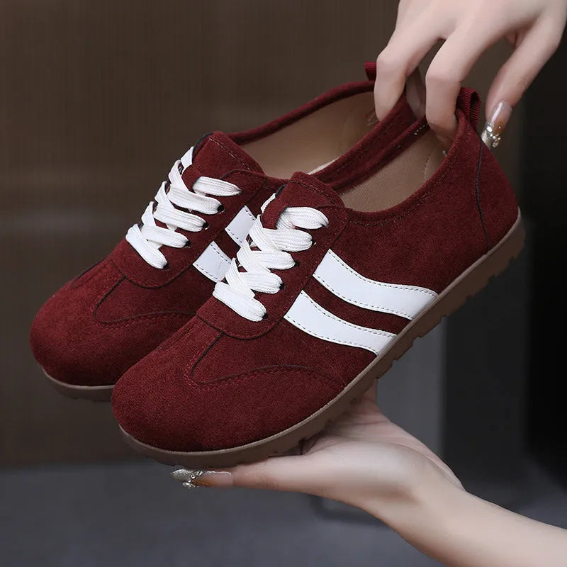 Women's canvas sneakers with round toe and flat rubber sole in dark red colour