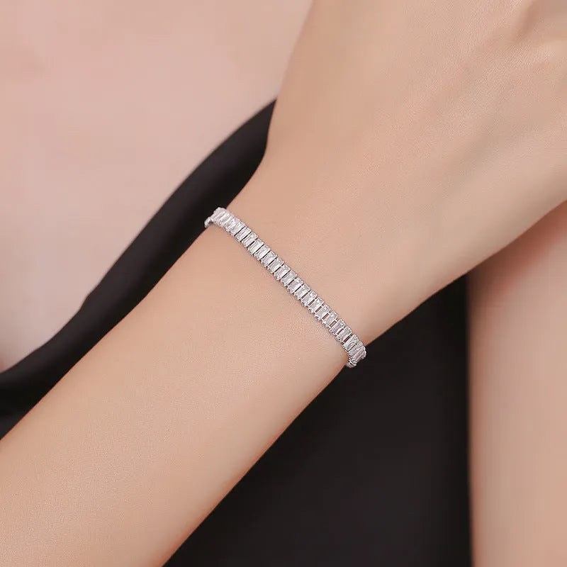 Geometric quadrilateral women's bracelet in brass with zircon stones in champagne gold finish