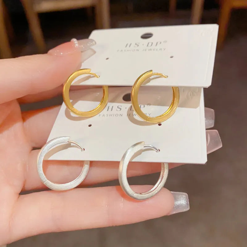 Geometric simple style gold or silver colour clip-on earrings for women with round eyelet design.