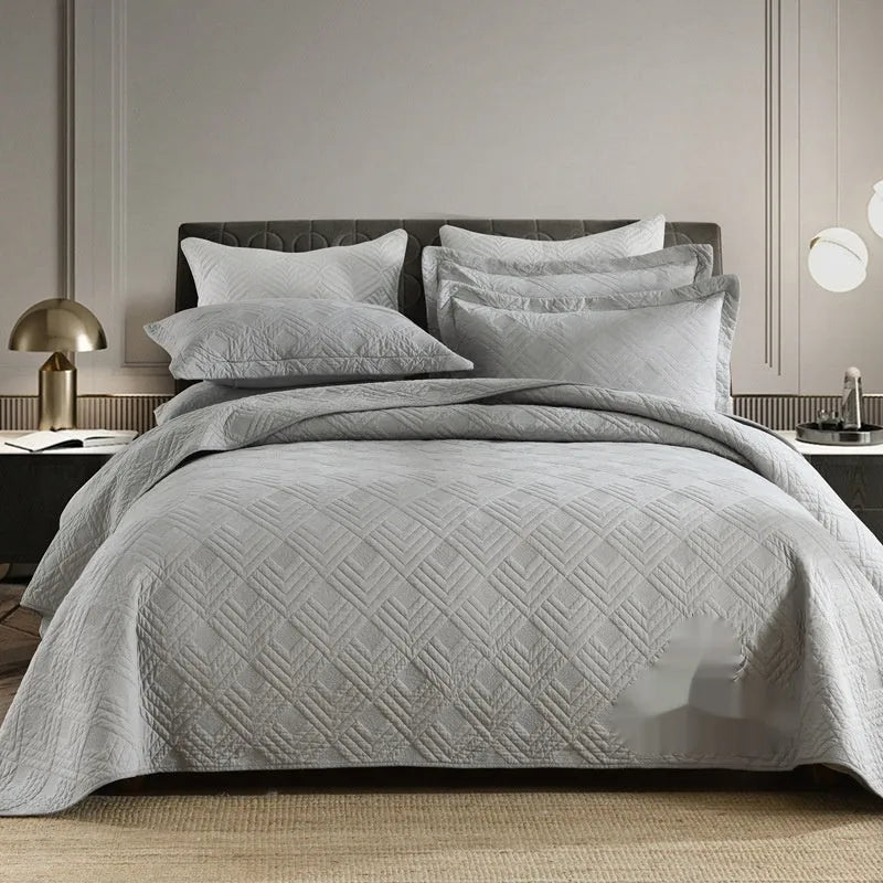 Pure cotton double-sided bed cover three-piece set in beige Damascus pattern on a bed.
