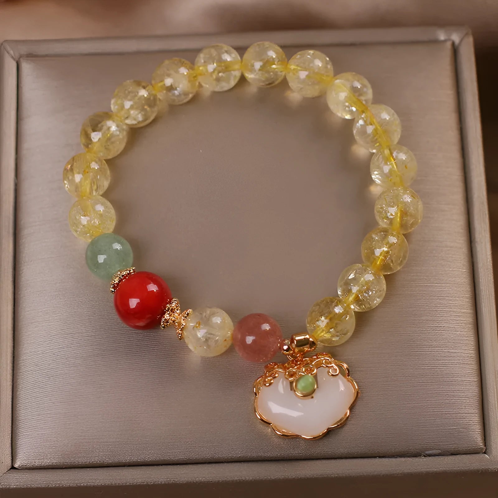 Women's bracelet with a natural yellow citrine jade ruyi pendant on an alloy chain