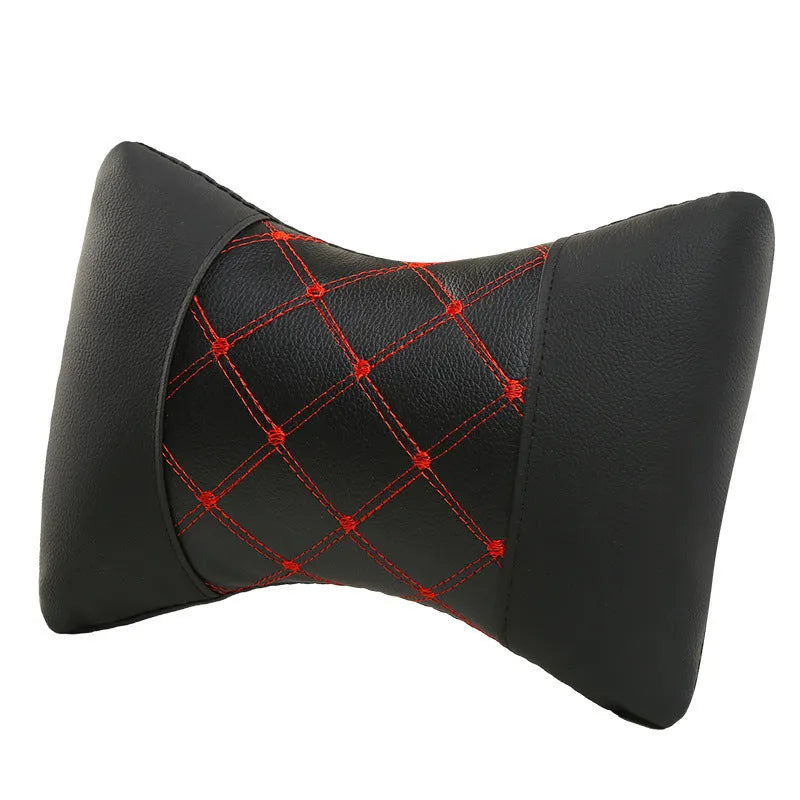 Black quilted diamond pattern car headrest neck pillow with contrast stitching.
