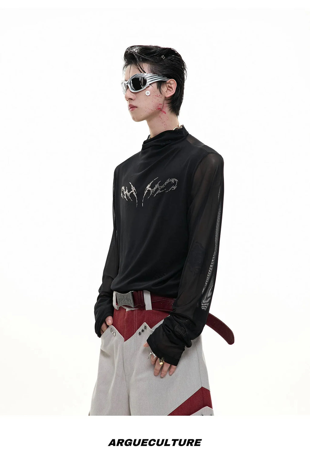Man wearing a black niche mesh slim-fit long sleeve shirt showing texture and fit.