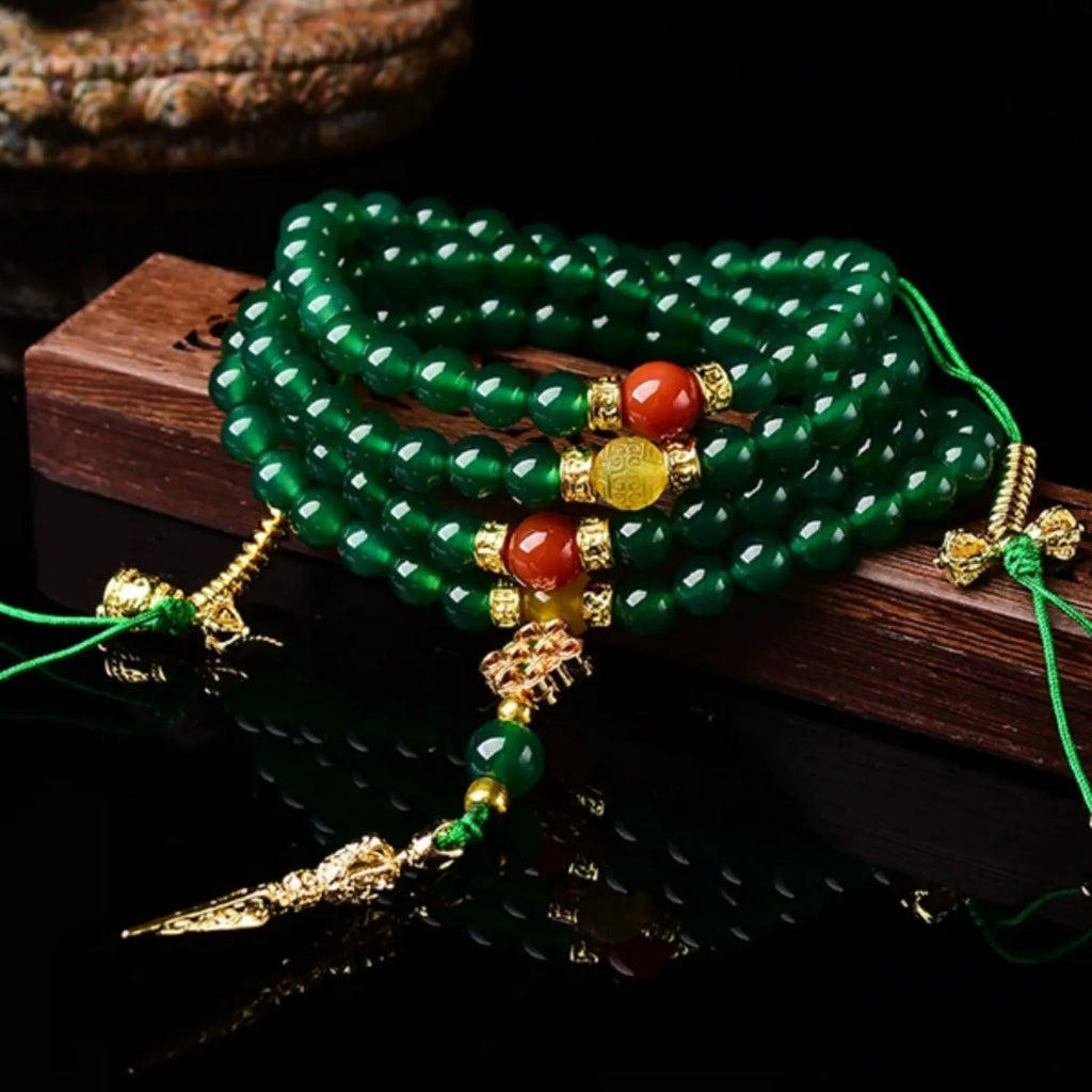 Close-up of a multi-circle green agate bracelet for men and women on a wrist.