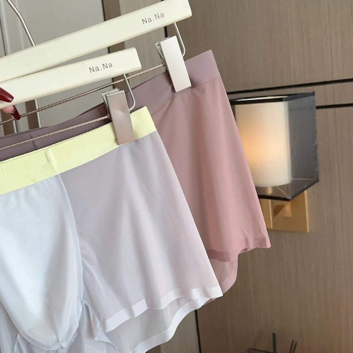 Seamless ice silk men's boxers in a solid colour on a mid-waist mannequin, showing honeycomb crotch detail.