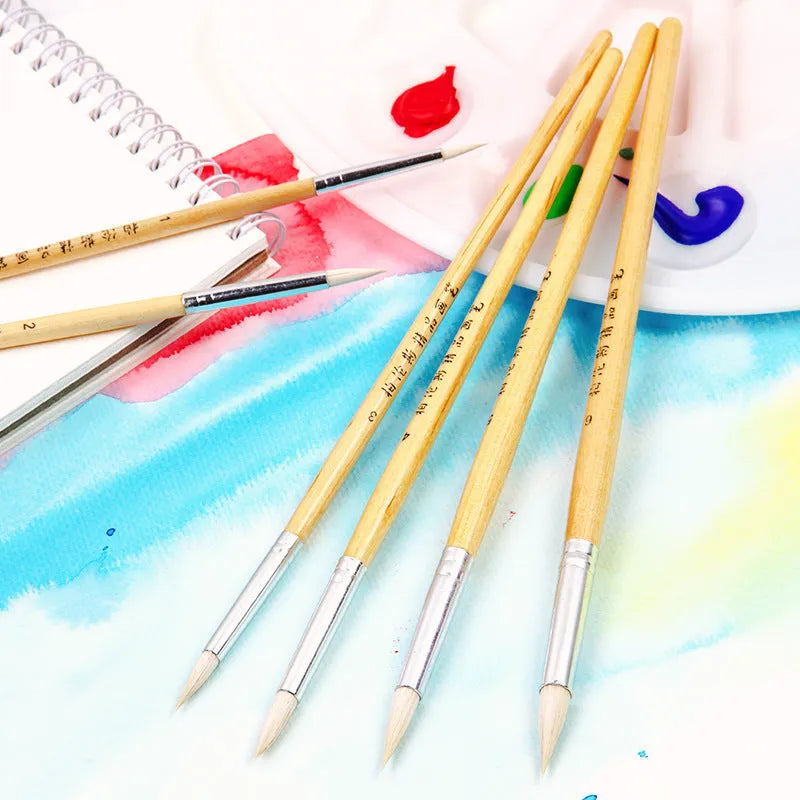 Six wooden hook line pen brushes for drawing and sketching arranged together.