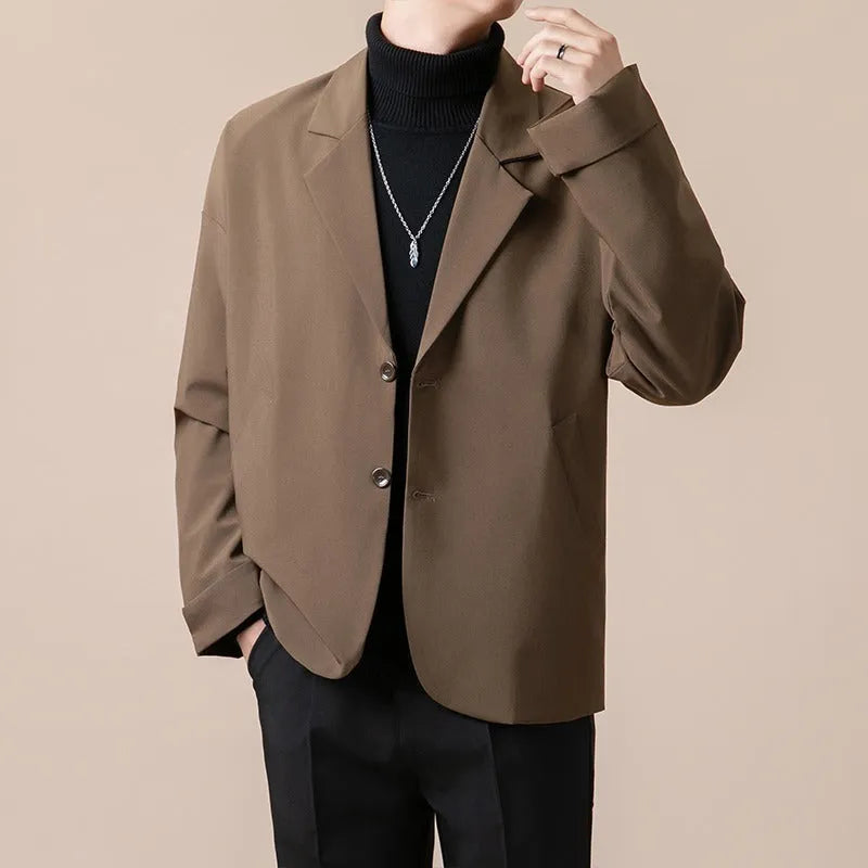Men's loose fit casual suit jacket in apricot colour, showing long sleeves and button front.