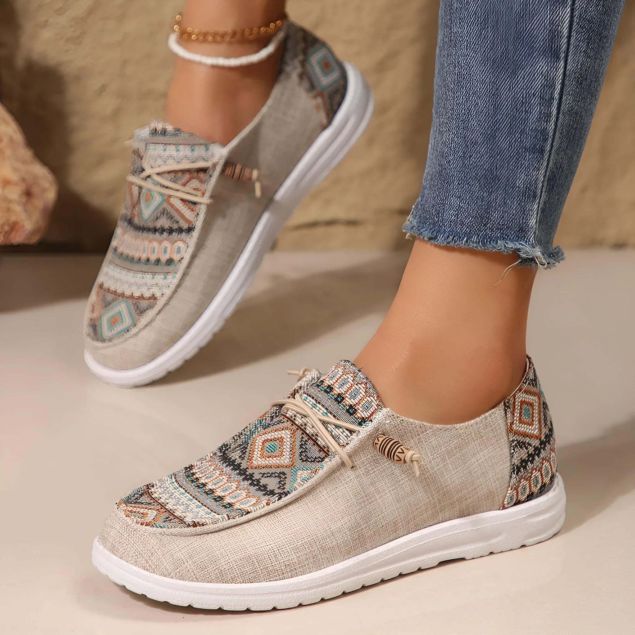 Women's low-top flat slip-on shoes in black, dark grey, or khaki with a round toe and rubber sole.