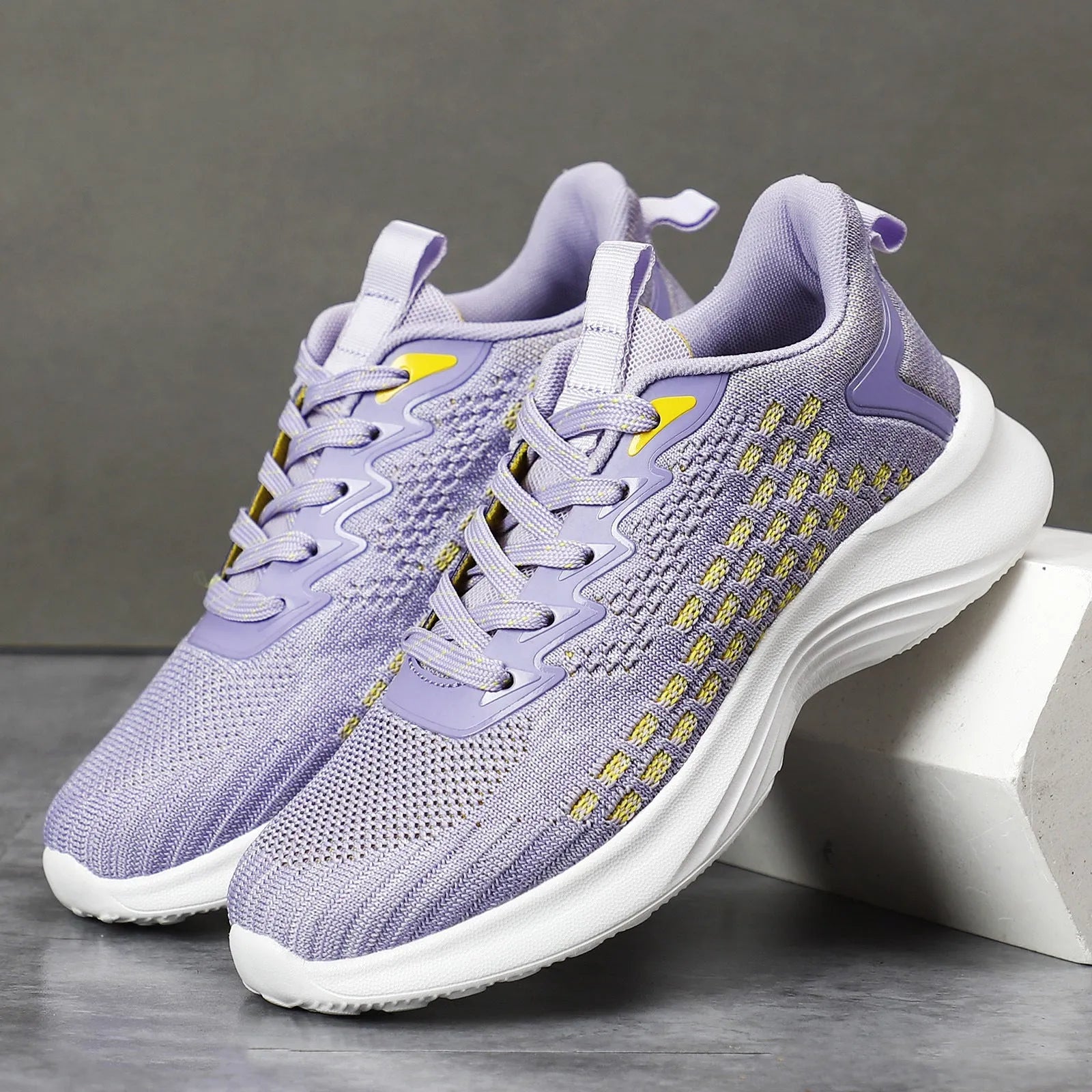 Women's Lavender Purple Flyknit running shoes with striped pattern, mesh upper, and flat EVA sole.