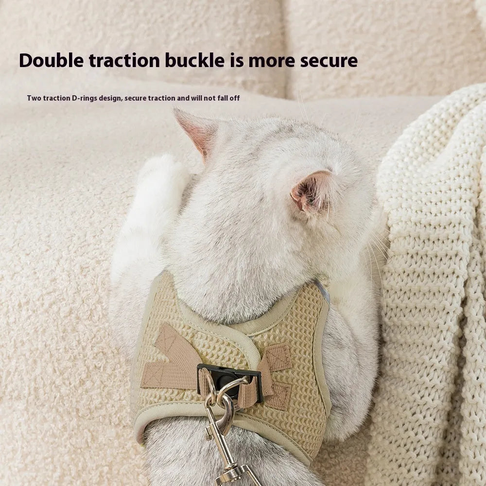 Brown cloth cat harness with integrated chest strap and leash for small cats.