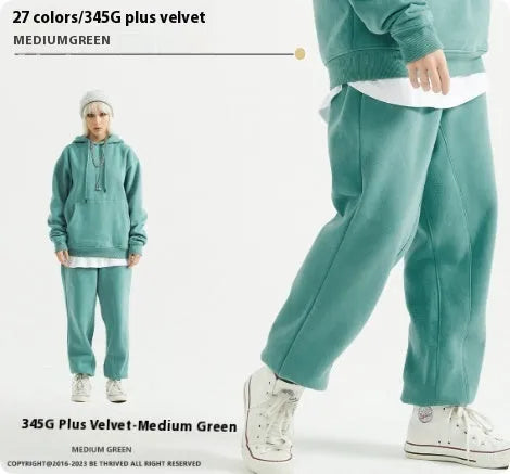 Man wearing dark brown cotton velvet sweatpants with an elasticated waist and ankle band.