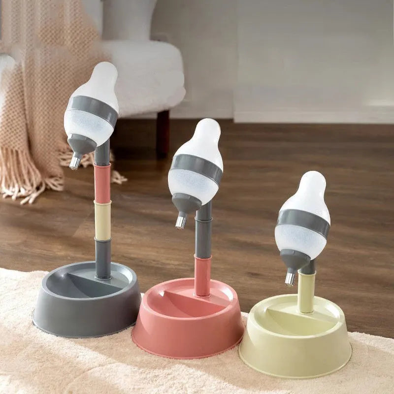 Green adjustable height pet water dispenser with detachable bowl and ball-tip nozzle on a kitchen floor.