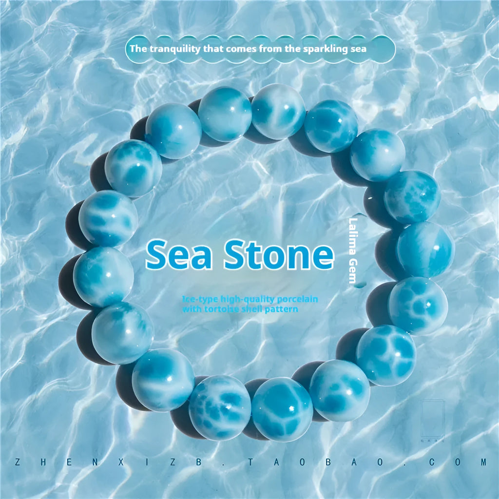 Blue handmade Bodhi bead bracelet with crystal sea-pattern stone and pearl accent on wrist