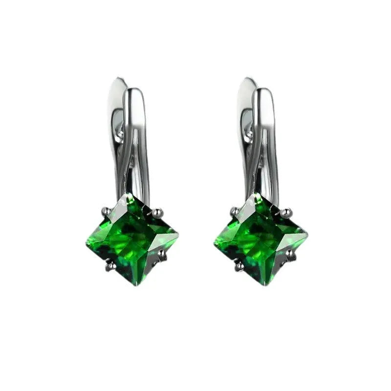 Women's copper earrings with a diamond design and inlaid blue zircon stones.