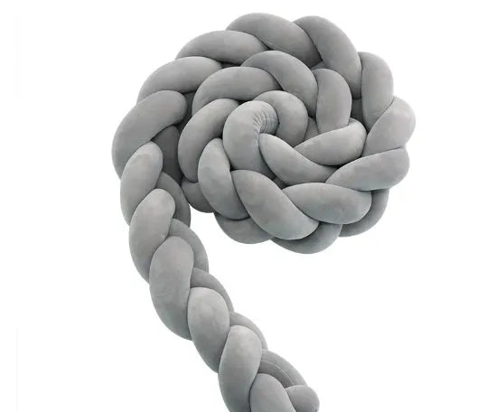Braided knot baby crib bumper pillow in spandex velvet showing bendable design and colour options.