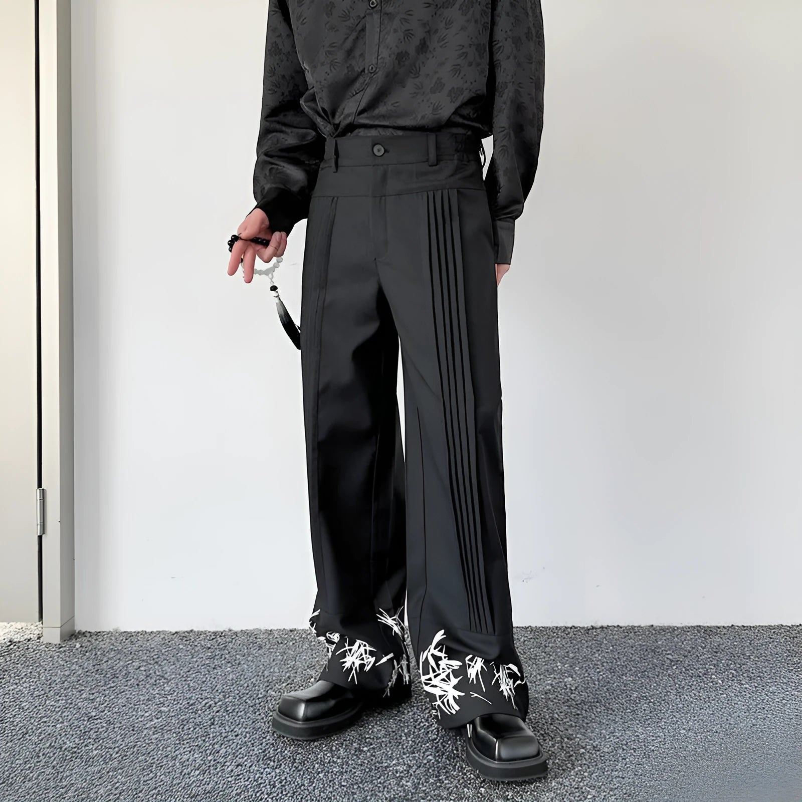 Pleated wide leg straight pants black cotton blend with elastic waist on mannequin