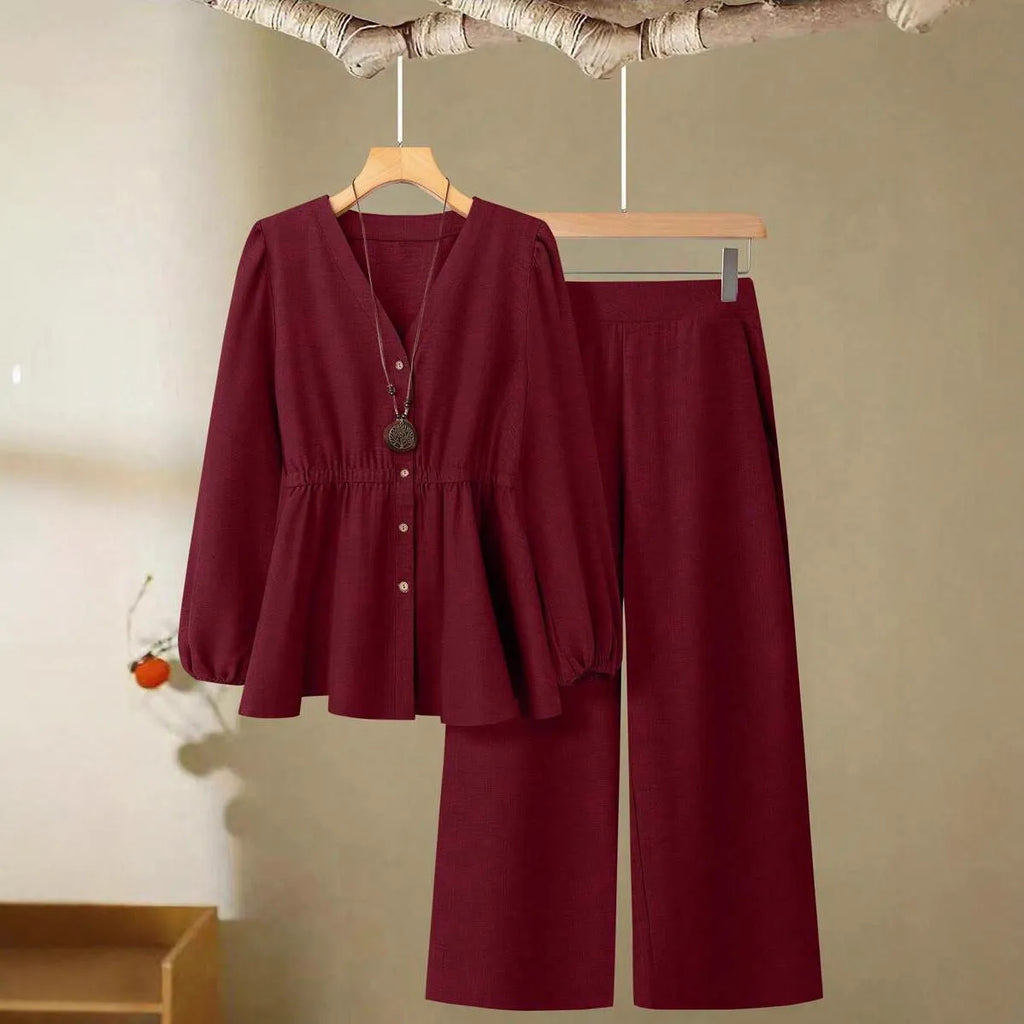 Women's long-sleeved two-piece polyester suit in khaki with button front top and matching trousers on model