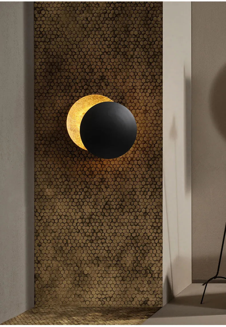 Modern minimalist aluminium bedside lamp with golden light in inner gold outer black finish