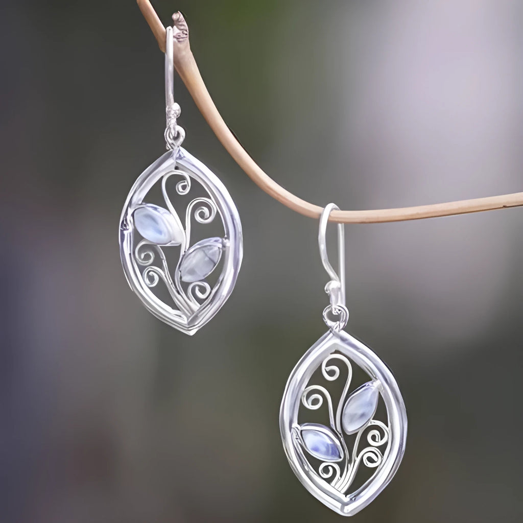 Silver alloy earrings with leaf shape containing colourful embedded moonstone
