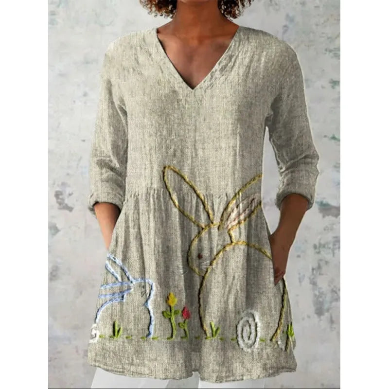Women's loose fitted printed wave dress with 3/4 sleeves and wide waistband on hanger
