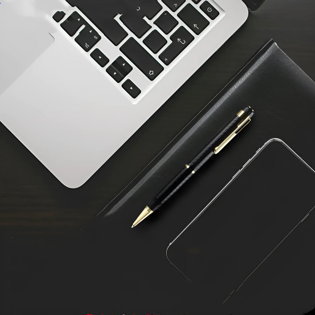 Black pen-shaped audio recorder with zinc alloy body, shown next to its included headset and data cable.