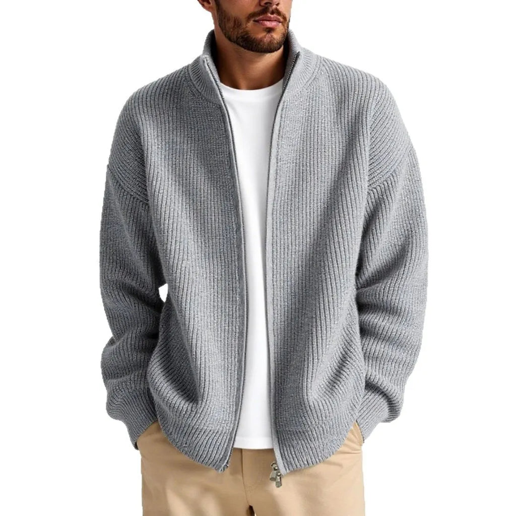 Men's loose fit cardigan sweater in grey, showing front button detail.