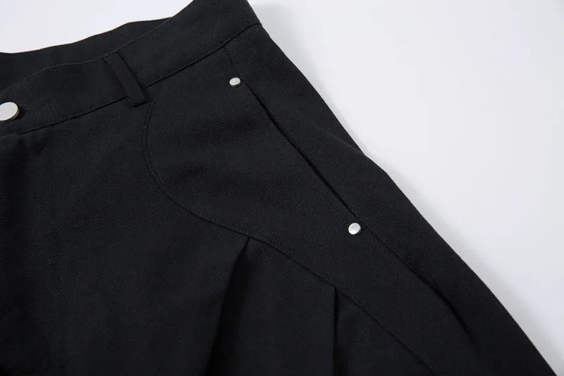Men's black pleated machete casual pants with loose-fitting wide-leg styling in cotton fabric