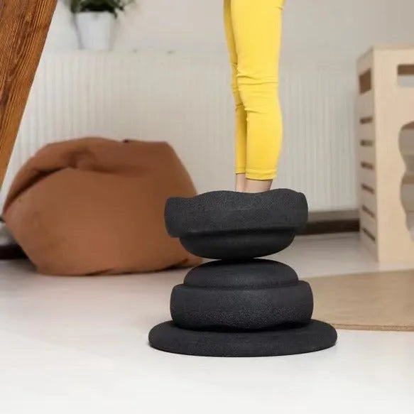 Plastic wood surf balance board for children in mixed colour or black wood effect finish.