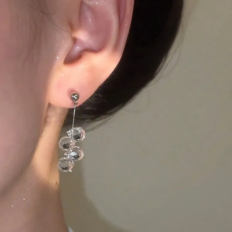 Silver needle simple crystal tassel earrings with geometric round shape in silver finish